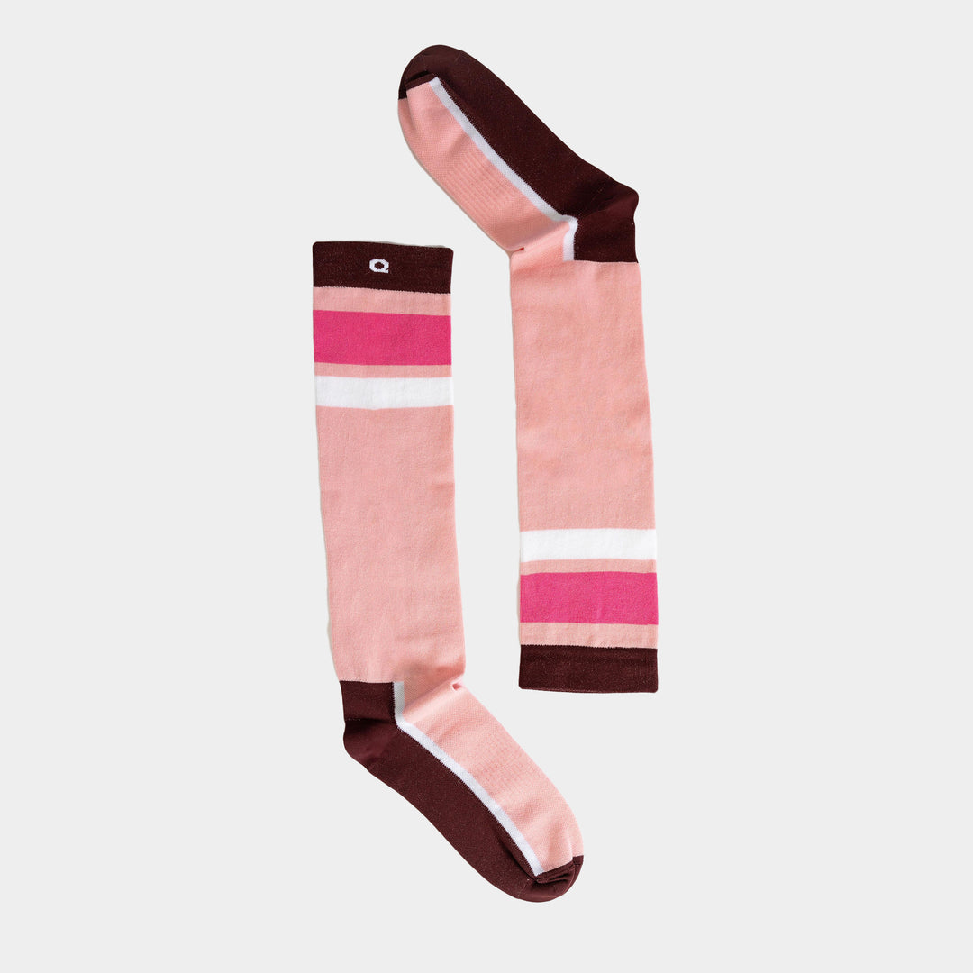 A pair of knee-high socks with pink, white, and magenta stripes, featuring brown toes, heels, and cuffs, displayed on a light background.