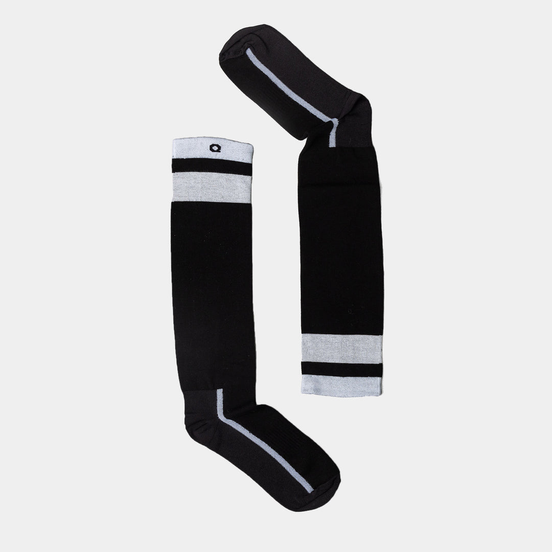 Two black knee-high socks with light gray cuffs and stripes, arranged on a white background to form the shape of the letter P.